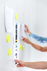 Business owner planning essential website pages for SEO, trust, and lead generation