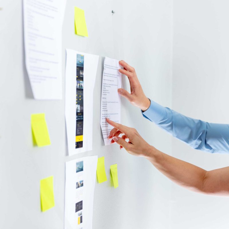 Business owner planning essential website pages for SEO, trust, and lead generation
