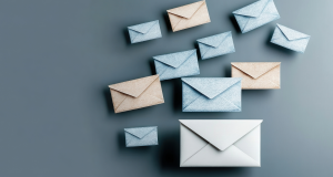 Blue, beige, and white envelopes arranged on a gray-blue background.